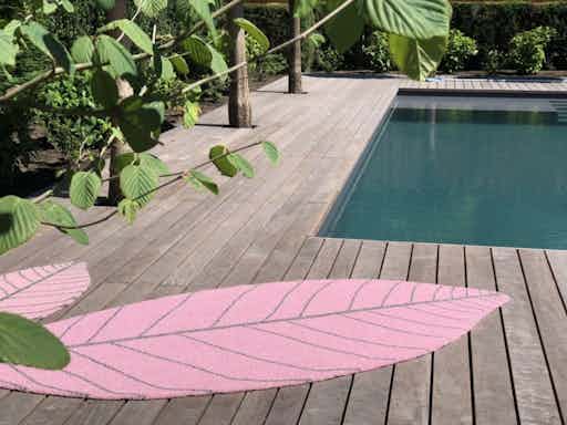 Carpet sign Symbiosis pink leaf rug outdoor insitu haute living